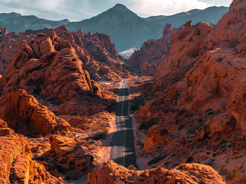 A road leading through the red rock formations of the Valley of Fire