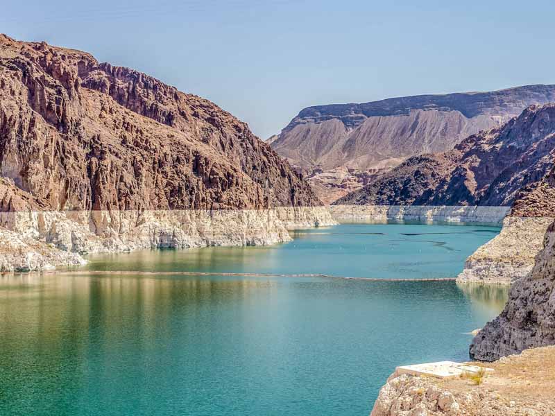 The Lake Mead reservoir, with blue-green water surrounded by rocky hills