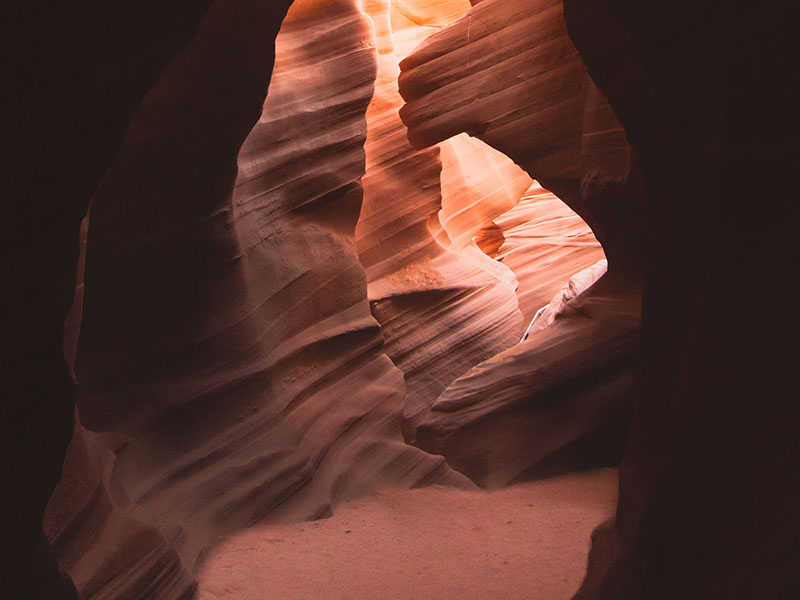 A view of Antelope Canyon, showing dark and light sections of rock wall