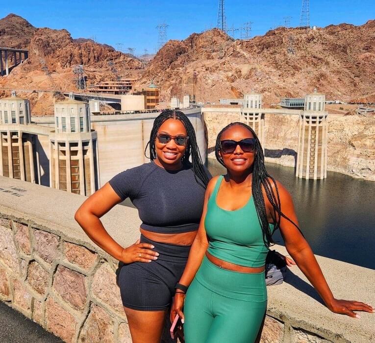 2 girls standing in front of the Hoover Dam