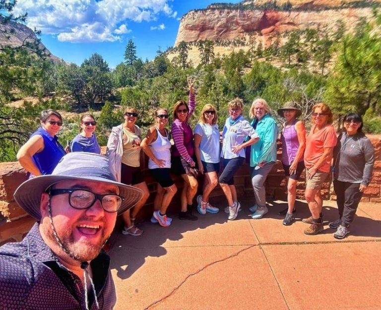 A group of tourists explore the stunning sites in Grand Canyon National Park.